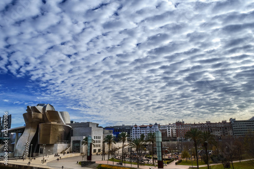 Nubes sobre el museo Guggenheim de Bilbao photo