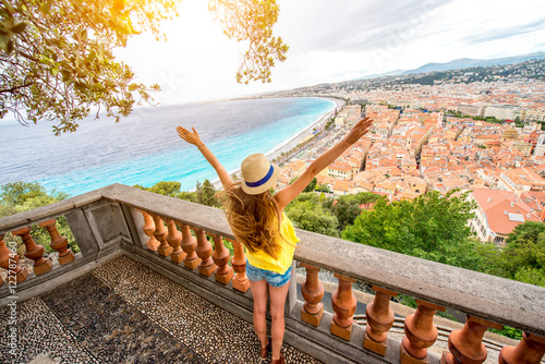 Young female traveler enjoying great view on the Nice city in France