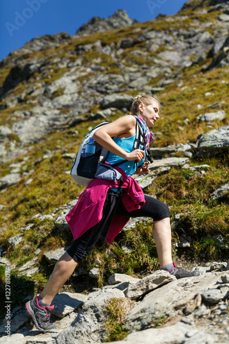 Woman backpacker hiking on a trail