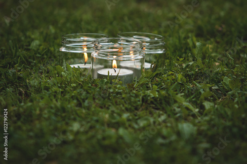 Small wedding candles on the grass