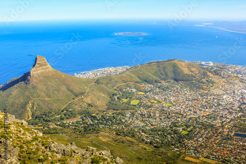 Aerial view of Lion's Head, the coast and Cape Town during a trek on the Table Mountain National Park, the promontory overlooking the city in Western Cape, South Africa. photo
