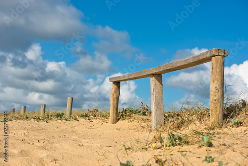 Wooden fence on Atlantic beach in France