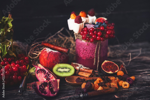Fresh smoothie on wooden table in the glass