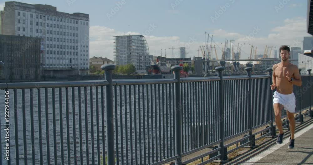 Man jogging with City Scape in background. Man jogging with City Scape in background.
