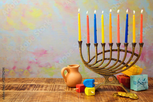 Принти на полотні Jewish holiday Hanukkah celebration with menorah, dreidel, gifts and oil jug on