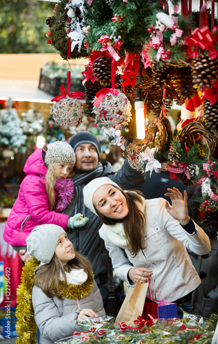Family standing at coniferous souvenirs counter