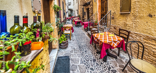 Fototapeta Naklejka Na Ścianę i Meble -  rustic tables in Castelsardo old town