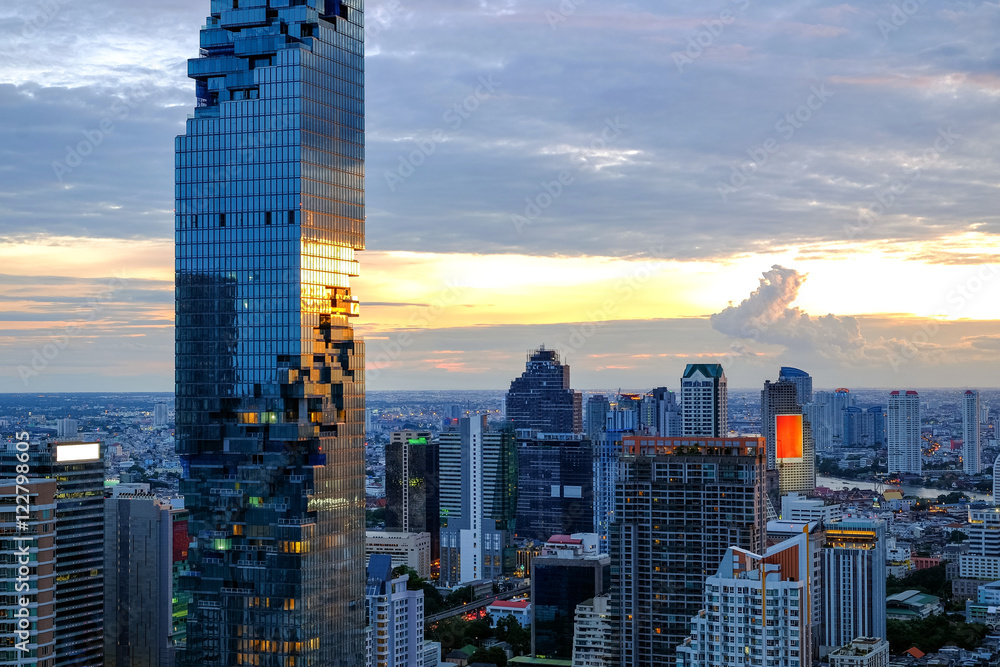 Cityscape from a high angle in Silom area, with Mahanakhon, which is a new building with a highest in Thailand, Bangkok, Thailand, Sunset sky