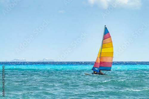 Sailboat sailing on the blue ocean