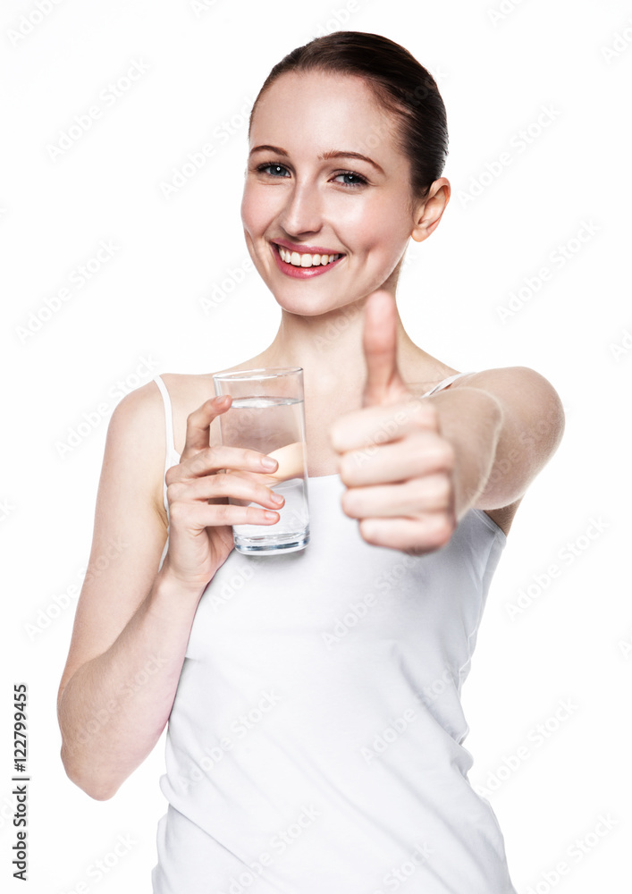 Beautiful girl holding glass with still healthy water Beautiful girl holding glass with still healthy water