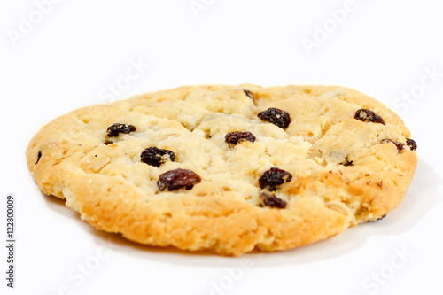 Cookies with raisins and chocolate lying on white background.