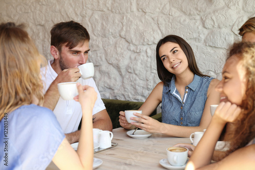 Happy friends drinking coff...
