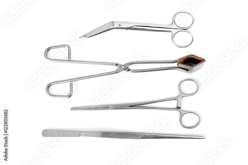 Flat lay of medical instruments on white background
