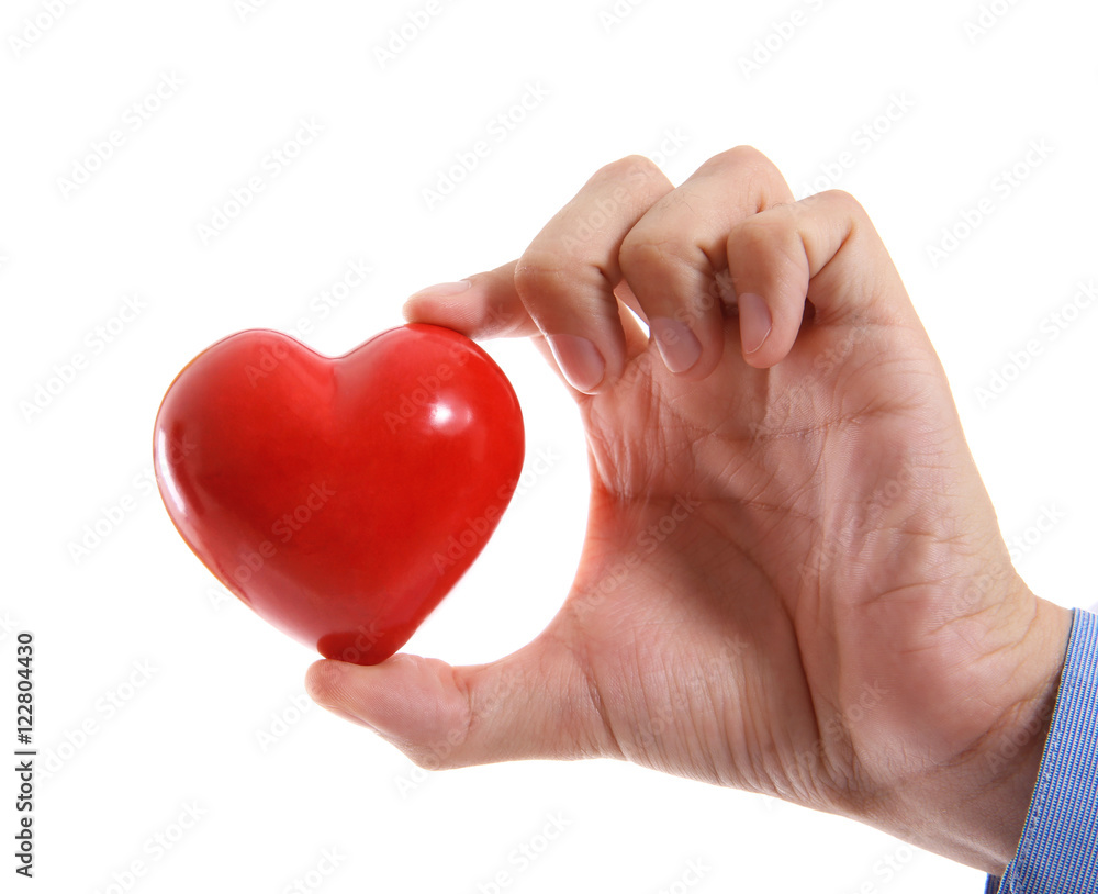 Male hand holding red heart on white background