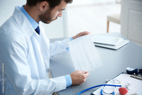 Male doctor at work in clin...