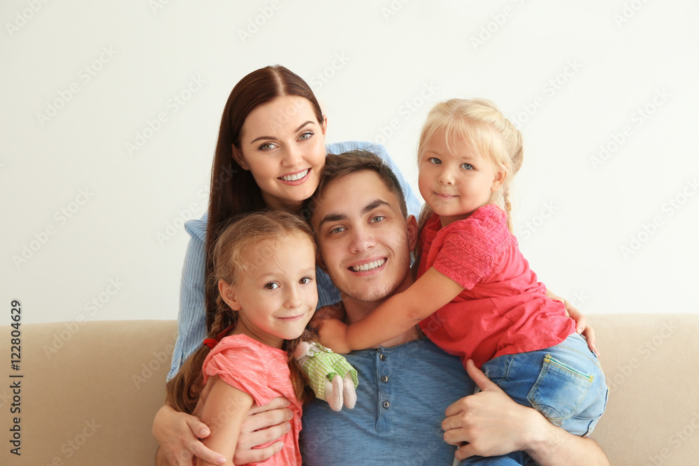 Happy parents with daughters at home