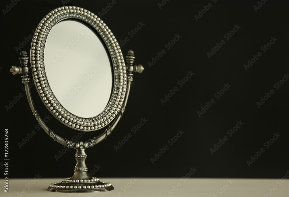 Female mirror on dark background Female mirror on dark background