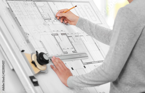 Fotografía Young creative male engineer working with new project on drawing board