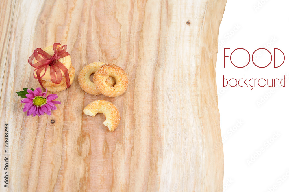 Food background. Nice cookies on wooden backdrop with ribbon and flower. Food background. Nice cookies on wooden backdrop with ribbon and flower.