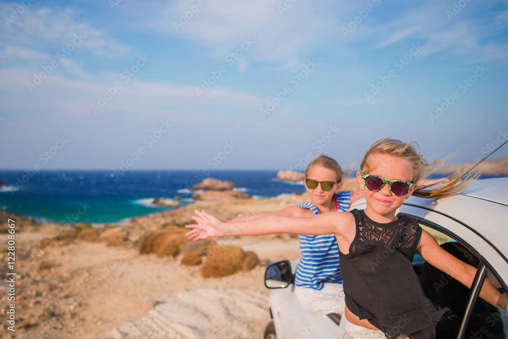 Kids on vacation travel by car. Summer holiday and car travel concept Kids on vacation travel by car. Summer holiday and car travel concept