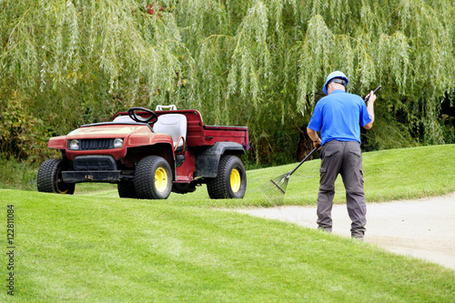 Foto Grounds keeper working on a golf course