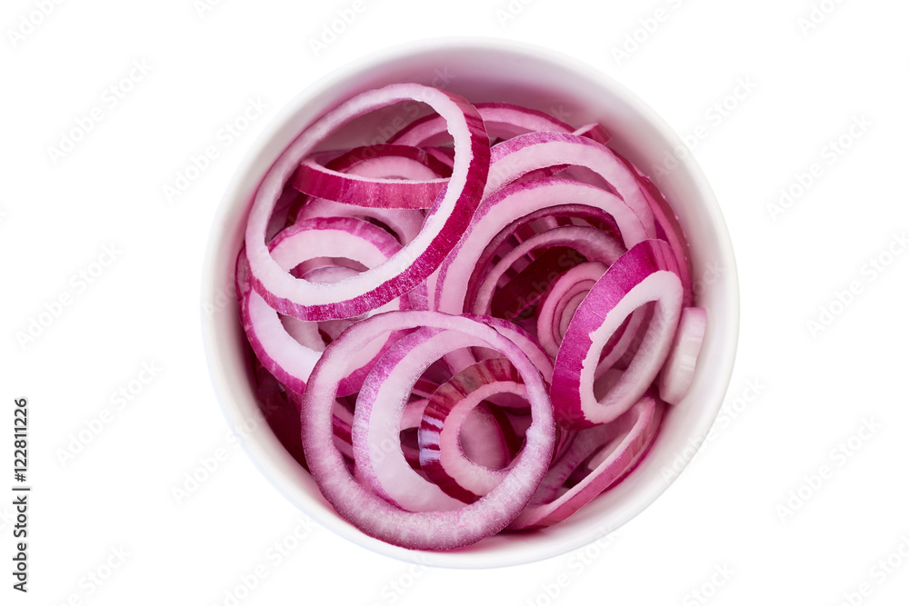 Fototapeta premium Sliced red onion in bowl on white.