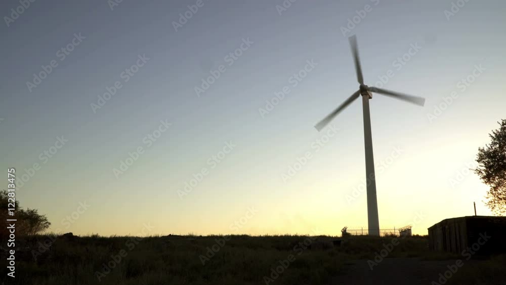 Wind turbine in the sun. wind turbine at sunset. At the steppes of Russia to the Urals. Saving the environment and alternative energy sources Wind turbine in the sun. wind turbine at sunset. At the steppes of Russia to the Urals. Saving the environment and alternative energy sources