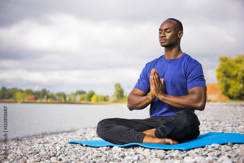 young man exercising yoga