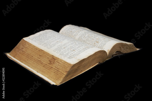 Open book isolated on a black background