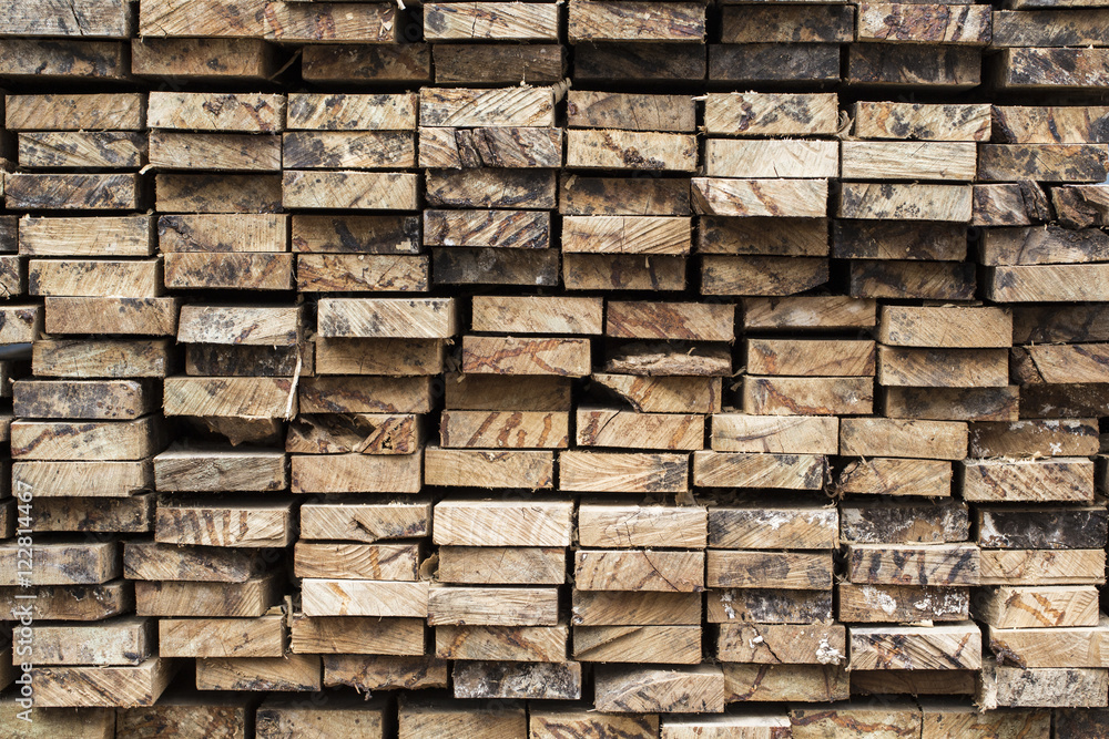 Pile of stacked rough cut lumber Pile of stacked rough cut lumber