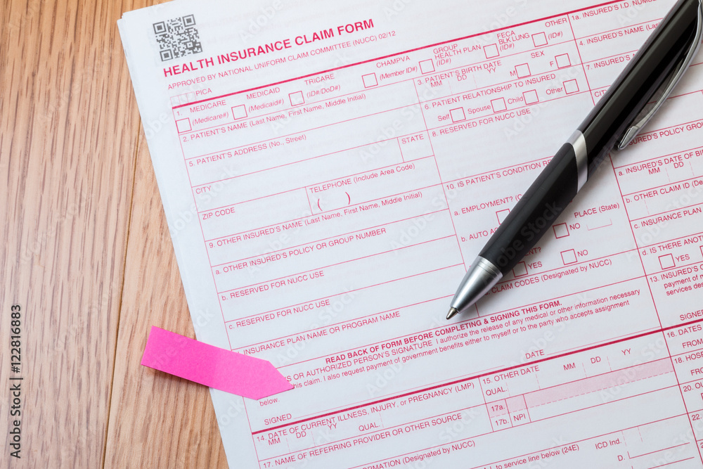 Health insurance claim form needing a signature with pen. Health insurance claim form needing a signature with pen.