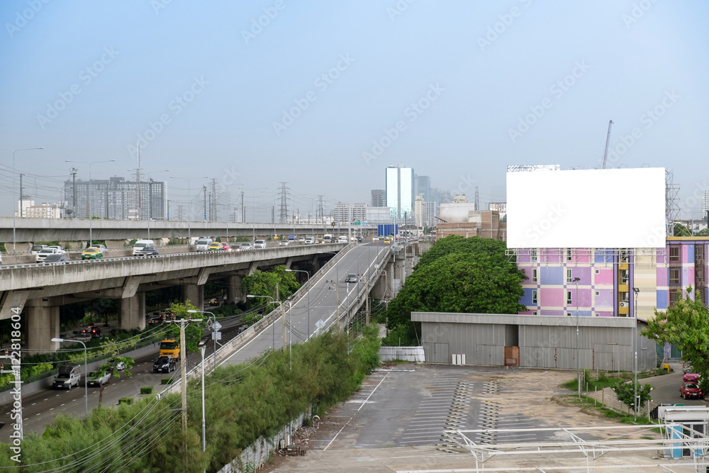 Traffic capital city cloudy with large billboard