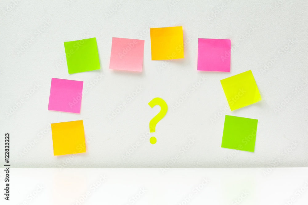 sticky notes with question marks over white sticky notes with question marks over white