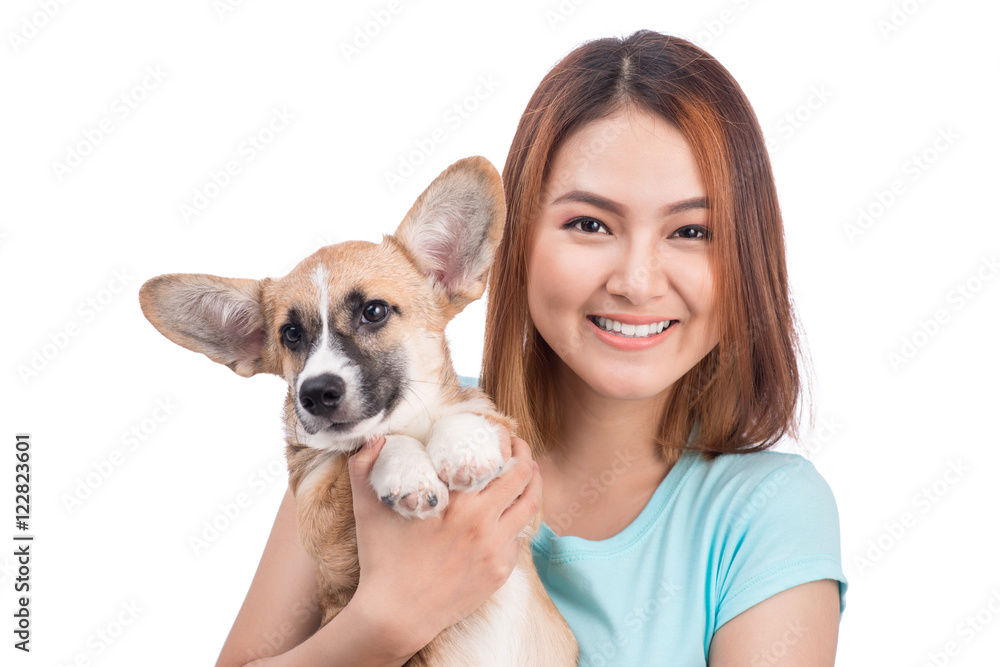 Young asian woman with a little puppy isolated over a white back Young asian woman with a little puppy isolated over a white back
