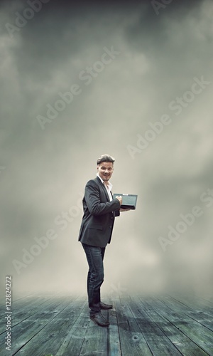 Businessman and His Laptop - On line Business Concept © REFURBISHED
