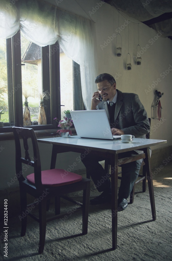 Businessman is Working with Mobile Phone and Laptop Businessman is Working with Mobile Phone and Laptop