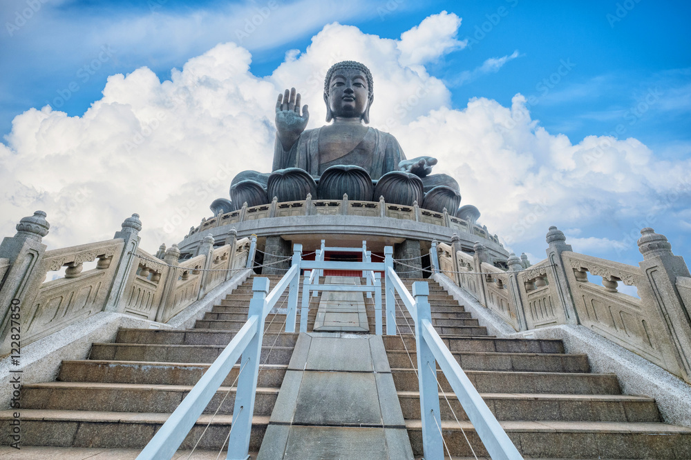 Fototapeta premium Tian Tan Buddha, Big Buddha in Hong Kong on big blue sky background