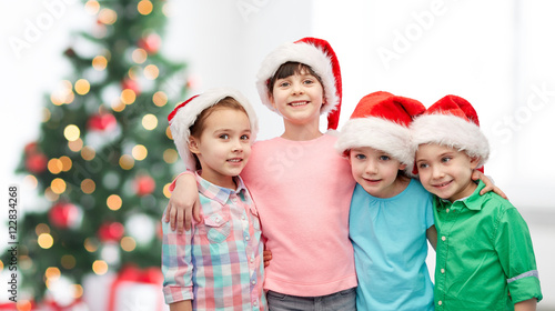 happy little children in christmas santa hats
