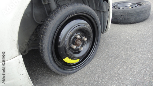 Car flat spare wheel on highway © fundemental