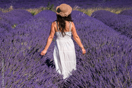 Woman in a lavender field in Valensole plateau, Provence (France)