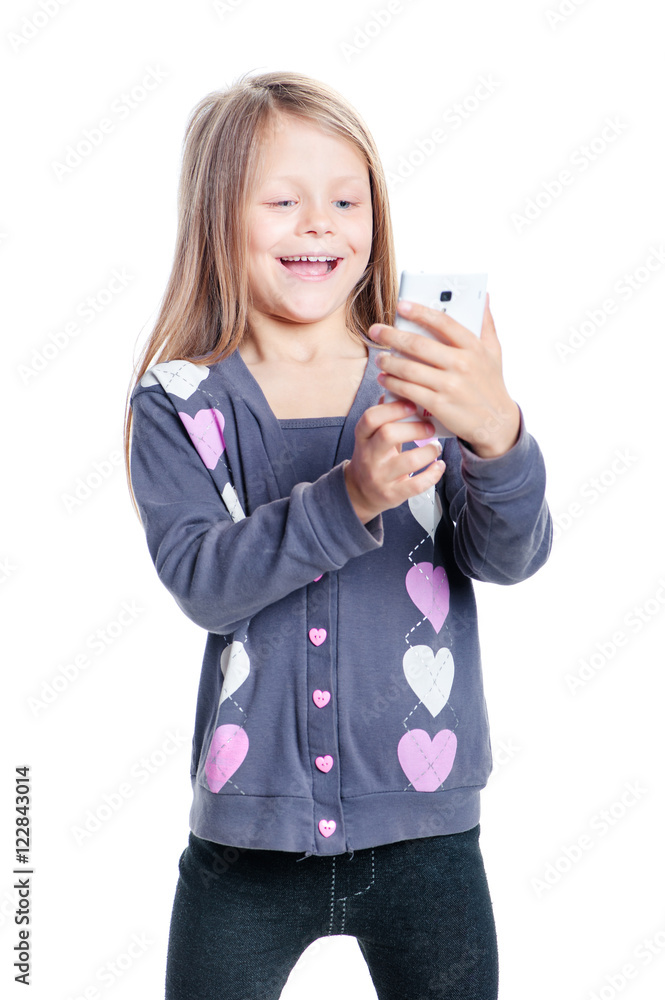 Childhood and technology. Cute little girl using smart phone. Isolated on white. Childhood and technology. Cute little girl using smart phone. Isolated on white.