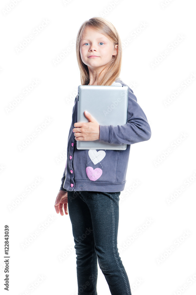 Childhood and technology. Studio portrait of pretty little girl holding tablet computer. Isolated on white. Childhood and technology. Studio portrait of pretty little girl holding tablet computer. Isolated on white.