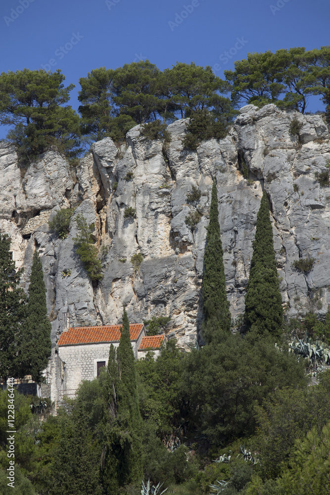 Little Saint Jerome stone church under Marjan hill cliffs in split Croatia
