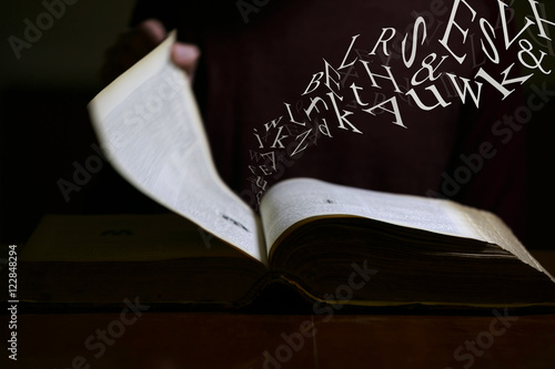 Text Flying out of Old Book