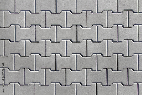 Urban street covered with gray concrete elements