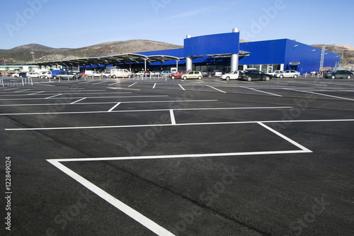White stripes on the blacktop on parking lot in the shopping mall
