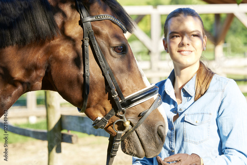 Fototapeta Naklejka Na Ścianę i Meble -  Beautiful woman with her sport horse.