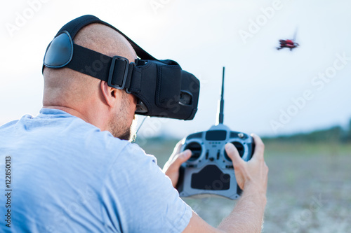 drone pilot using fpv goggles to fly