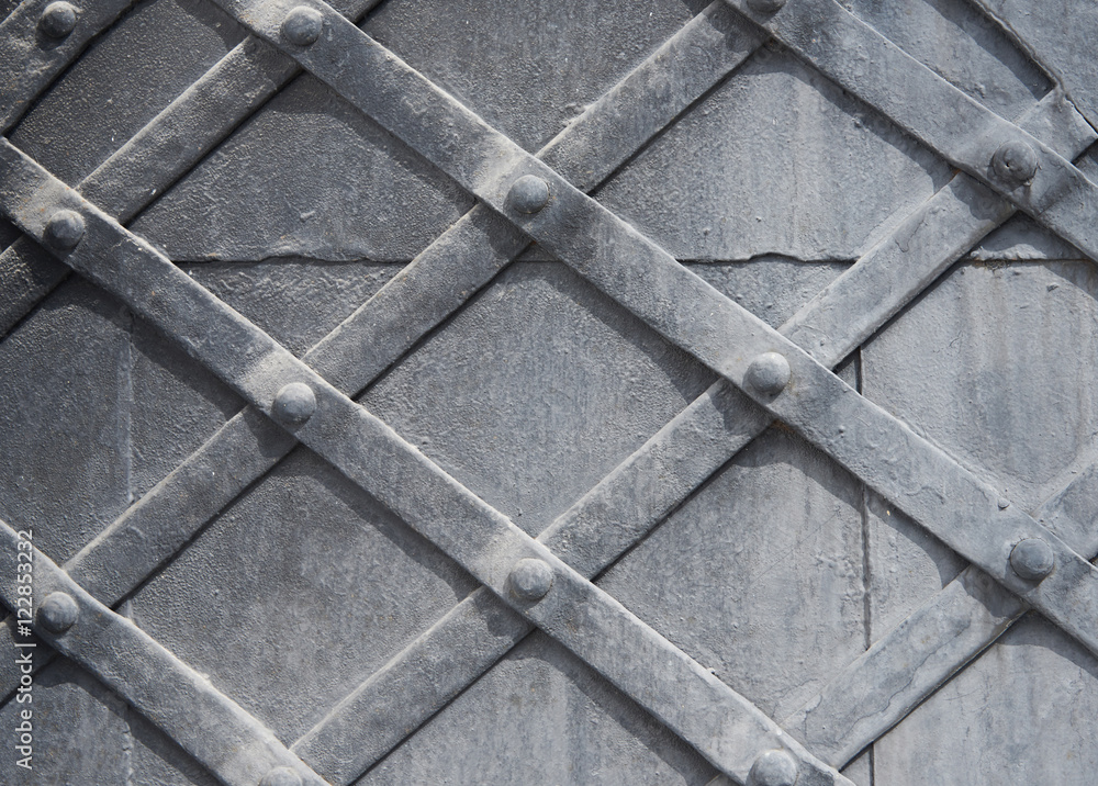 Obraz premium A fragment of an old wooden door gray. Texture, background