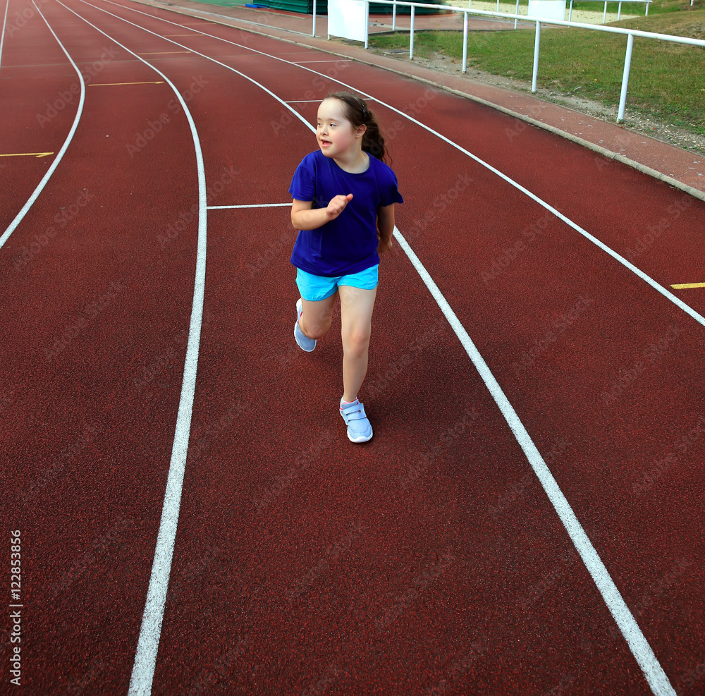 Little girl have fun on the stadium